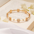 Sparkling Flower with Emerald Stone Swarovski Golden Bangles