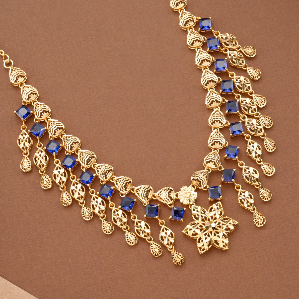 Fancy Floral Pendant Blue Stone Golden Necklace Set