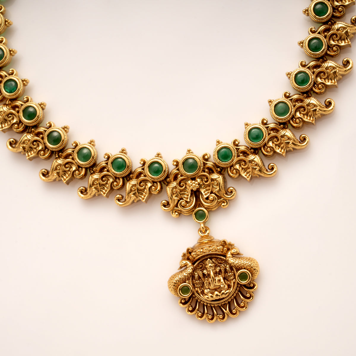 Traditional Mango Design Emerald Stone Golden Necklace