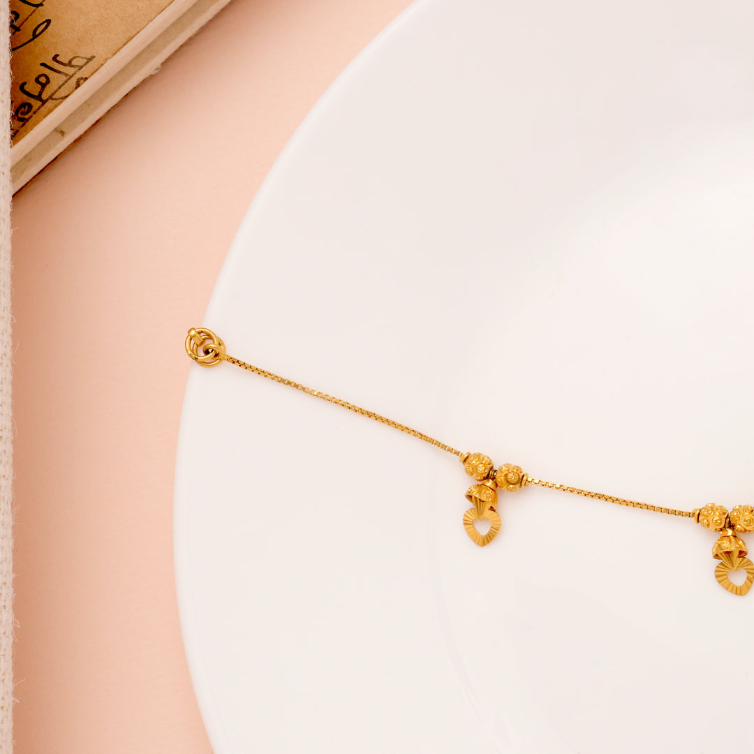 Regal Heart Drops Gold Ball Bracelet for Women