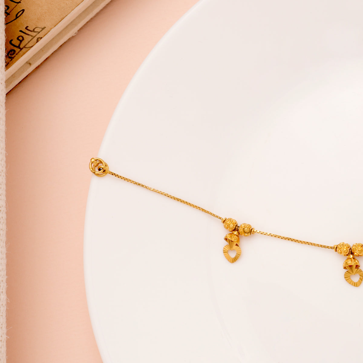 Regal Heart Drops Gold Ball Bracelet for Women