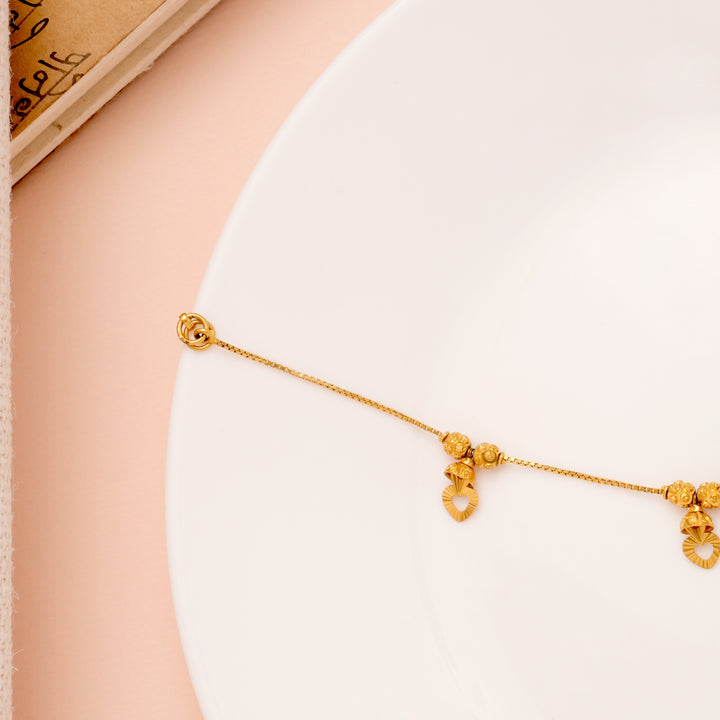 Regal Heart Drops Gold Ball Bracelet for Women