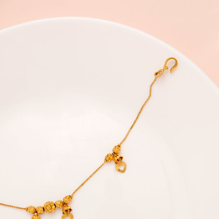 Regal Heart Drops Gold Ball Bracelet for Women