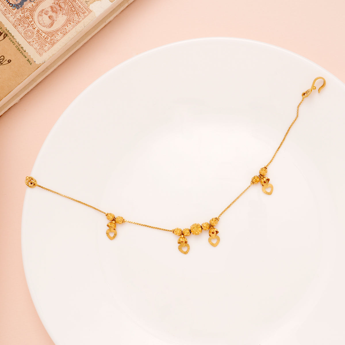 Regal Heart Drops Gold Ball Bracelet for Women