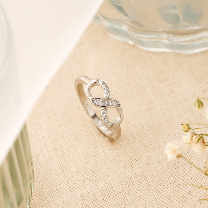 Elegant Infinity Ring with White Stone