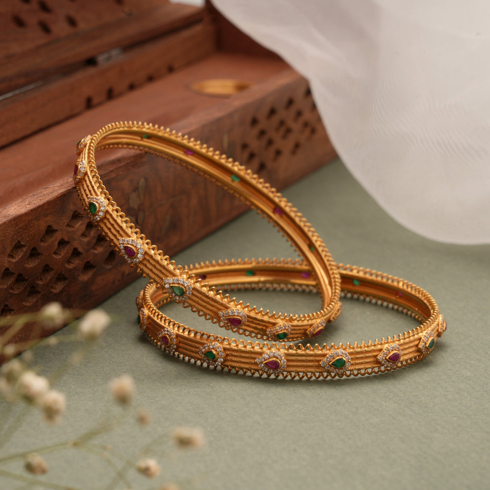 Multi Stone Teardrop Design with Gold Bangles