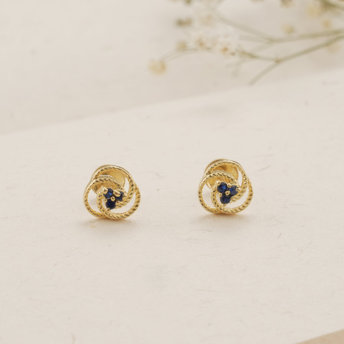 Twisted Rope Design Blue Stone Golden Stud