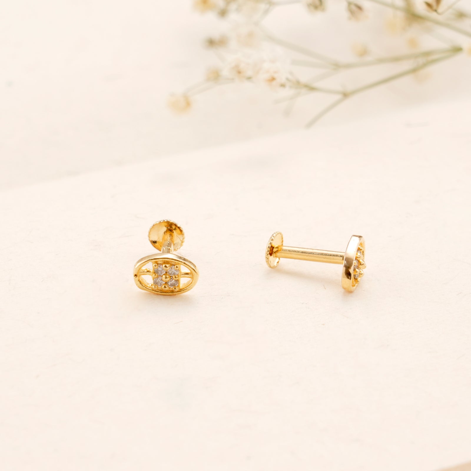 Oval Design White Stone Casting Golden Stud