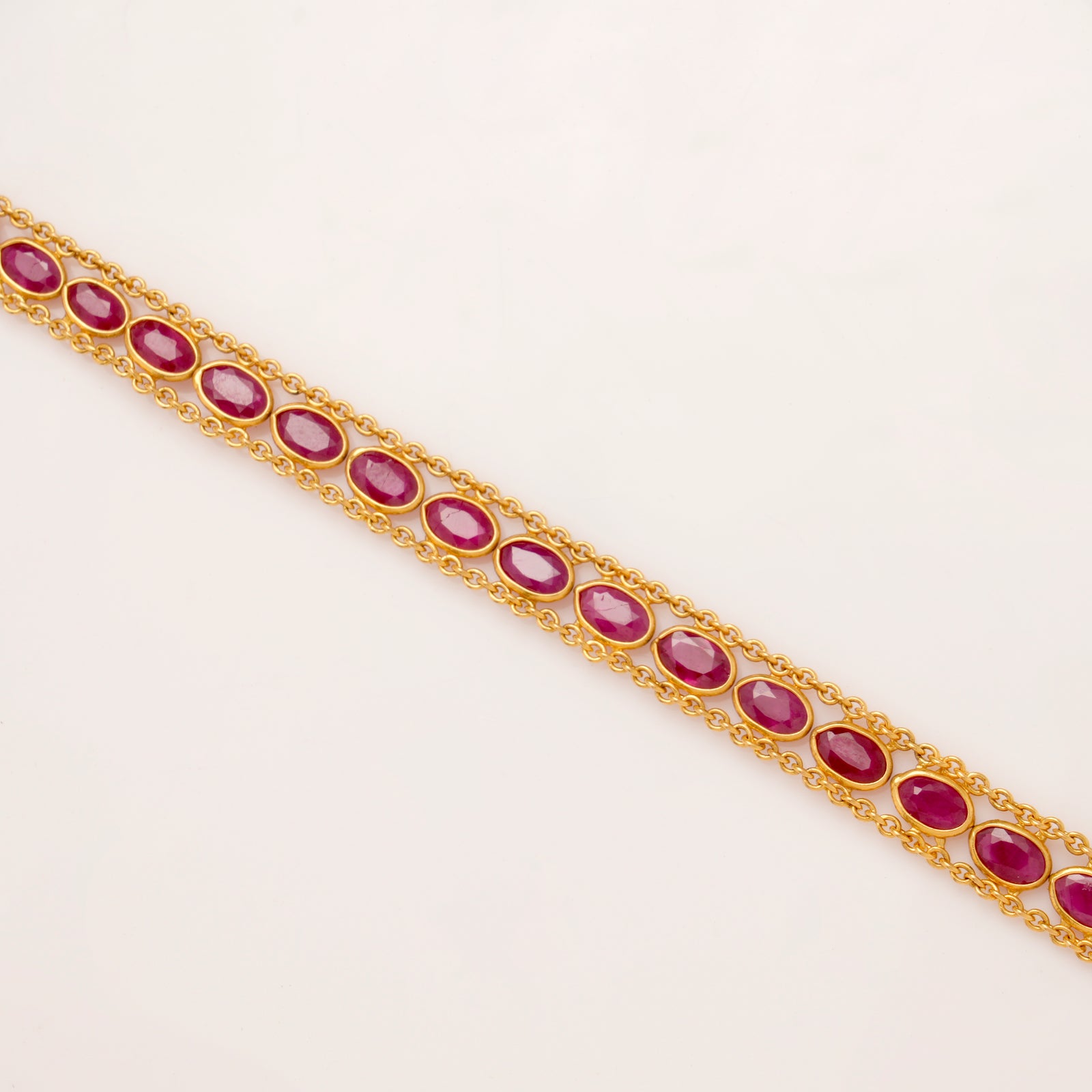 Elite Oval Shape Ruby Stone Gold Bracelet