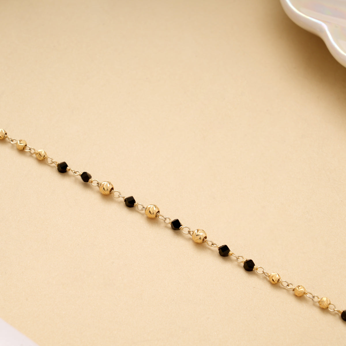 Golden Ball with Black Beads Bracelet