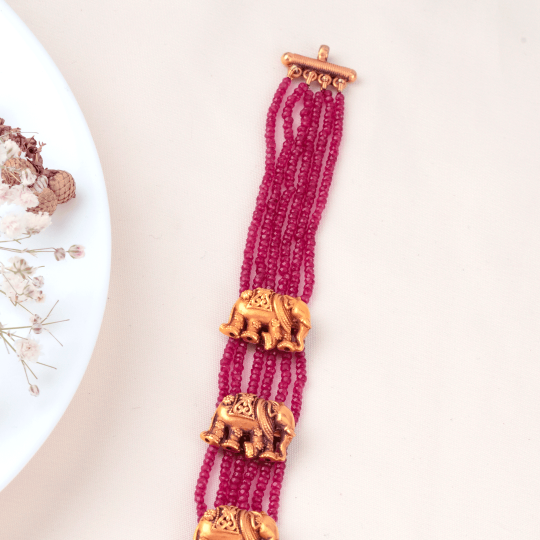 Ruby Beads with Elephant Motif Gold Haram